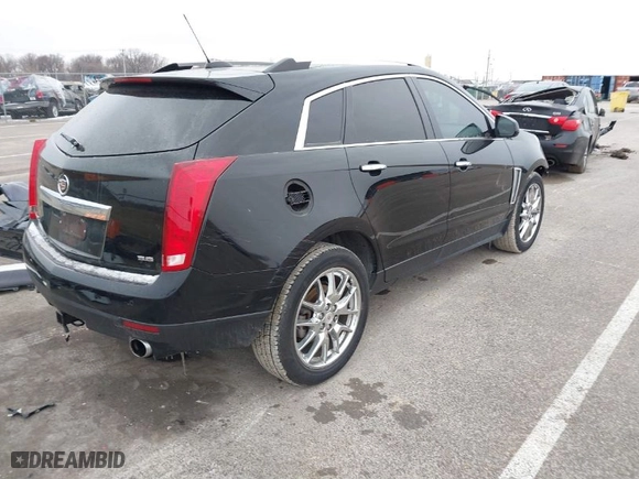 2015 Cadillac SRX Performance Collection with VIN 3GYFNFE35FS546905, listed as a IAAI auction lot 41588405 with 145,620 mi miles. Bid and sale history available at carsss.com. Image 4.