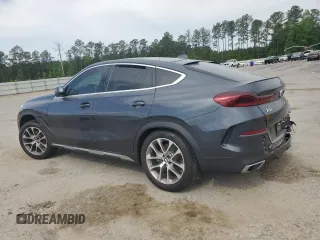 2020 BMW X6 xDrive40i z VIN 5UXCY6C03L9B94299, wystawiony jako Copart lot #53857965 z przebiegiem 54 133 mil mil oraz Szkody całkowita. Historia ofert i sprzedaży dostępna na DreamBid. Obrazek 2.