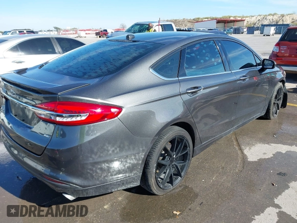 2018 Ford Fusion SE z VIN 3FA6P0H70JR191384, wystawiony jako IAAI lot #41340319 z przebiegiem 89 581 mil mil oraz . Historia ofert i sprzedaży dostępna na DreamBid. Obrazek 4.