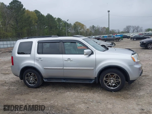 2014 Honda Pilot Touring with VIN 5FNYF4H91EB011934, listed as a IAAI auction lot 41929415 with 227,343 mi miles and . Bid and sale history available at DreamBid. Image 13.