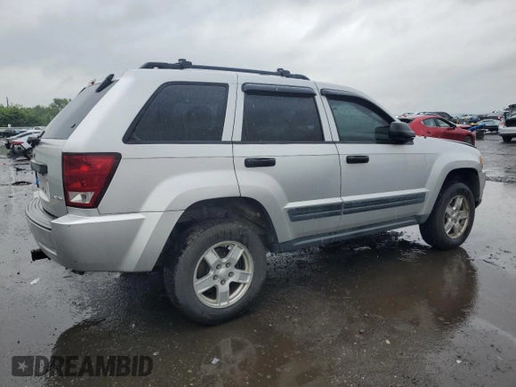 2005 Jeep Grand Cherokee Laredo with VIN 1J4GR48K55C719634, listed as a Copart auction lot 61809195 with 141,316 mi miles and Salvage title. Bid and sale history available at DreamBid. Image 3.