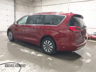 2021 Chrysler Pacifica Hybrid Touring L with VIN 2C4RC1L71MR581260, listed as a IAAI auction lot 42014401 with 68,719 mi miles and . Bid and sale history available at DreamBid. Image 3.