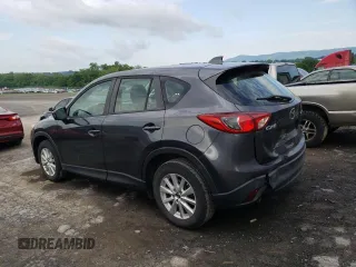 2014 Mazda CX-5 Sport with VIN JM3KE2BE9E0372370, listed as a Copart auction lot 58980165 with 175,477 mi miles and Salvage title. Bid and sale history available at DreamBid. Image 2.