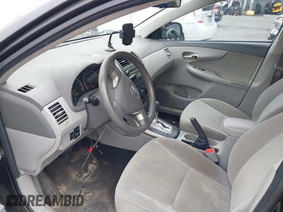 2010 Toyota Corolla with VIN 1NXBU4EE1AZ285449, listed as a IAAI auction lot 42040668 with 121,404 mi miles and . Bid and sale history available at carsss.com. Image 5.