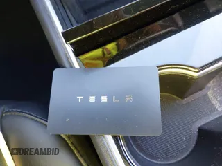 2018 Tesla Model 3 Long Range Battery with VIN 5YJ3E1EA2JF014975, listed as a IAAI auction lot 41319407 with 106,301 mi miles and . Bid and sale history available at DreamBid. Image 11.