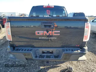 2021 GMC Canyon 4WD AT4 w/Leather with VIN 1GTG6FEN3M1274409, listed as a Copart auction lot 42502355 with 57,194 mi miles and Salvage Title. Bid and sale history available at carsss.com. Image 6.