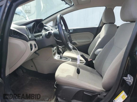 2014 Ford Fiesta SE z VIN 3FADP4EJ5EM182407, wystawiony jako Copart lot #51848425 z przebiegiem 134 347 mil mil oraz Szkoda całkowita • Salvage title. Historia ofert i sprzedaży dostępna na DreamBid. Obrazek 7.
