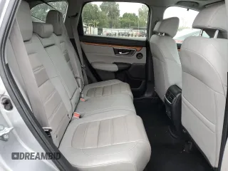 2020 Honda CR-V Touring z VIN 7FARW1H96LE006653, wystawiony jako Copart lot #57167475 z przebiegiem 49 286 mil mil oraz Szkoda całkowita • Salvage title. Historia ofert i sprzedaży dostępna na DreamBid. Obrazek 11.