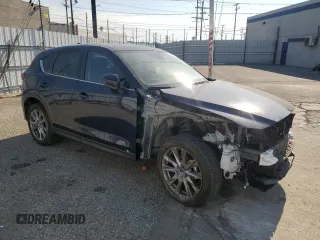 2021 Mazda CX-5 Grand Touring with VIN JM3KFADM7M0385788, listed as a Copart auction lot 88065255 with 27,787 mi miles and Salvage Title. Bid and sale history available at carsss.com. Image 4.