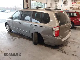 2010 Kia Sedona LX with VIN KNDMG4C31A6331565, listed as a IAAI auction lot 41860255 with 219,233 mi miles. Bid and sale history available at carsss.com. Image 3.
