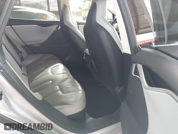 2014 Tesla Model S 60 with VIN 5YJSA1H17EFP35351, listed as a IAAI auction lot 41558434 with 151,002 mi miles and . Bid and sale history available at DreamBid. Image 8.
