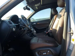 2016 Audi Q3 Prestige z VIN WA1GFCFS8GR001050, wystawiony jako Copart lot #49400595 z przebiegiem 104 091 mil mil oraz Szkoda całkowita • Salvage title. Historia ofert i sprzedaży dostępna na DreamBid. Obrazek 7.