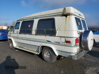 1995 GMC Vandura z VIN 1GDEG25K1SF505970, wystawiony jako Copart lot #87524905 z przebiegiem 130 163 mil mil oraz Tytuł czysty. Historia ofert i sprzedaży dostępna na DreamBid. Obrazek 2.