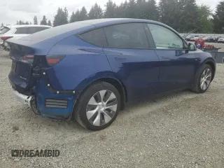 2022 Tesla Model Y Long Range z VIN 7SAYGDEE6NF429651, wystawiony jako Copart lot #57172355 z przebiegiem 19 499 mil mil oraz Szkoda całkowita • Salvage title. Historia ofert i sprzedaży dostępna na DreamBid. Obrazek 3.