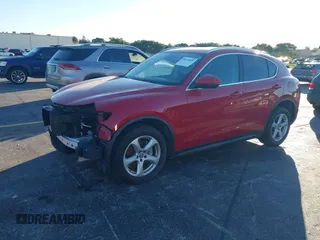 2018 Alfa Romeo Stelvio z VIN ZASFAKAN3J7C20066, wystawiony jako IAAI lot #40879859 z przebiegiem 50 131 mil mil oraz . Historia ofert i sprzedaży dostępna na DreamBid. Obrazek 2.