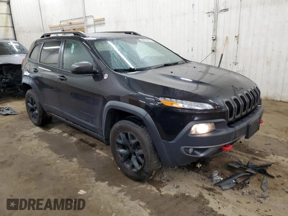 2015 Jeep Cherokee Trailhawk z VIN 1C4PJMBS0FW598694, wystawiony jako Copart lot #60731615 z przebiegiem 130 219 mil mil oraz Czysty tytuł • Clean title. Historia ofert i sprzedaży dostępna na DreamBid. Obrazek 4.
