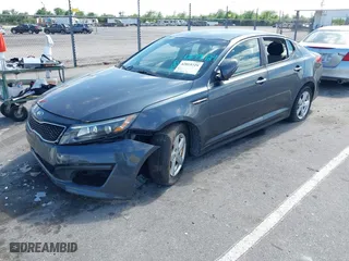 2015 Kia Optima LX with VIN KNAGM4A71F5634755, listed as a IAAI auction lot 42019729 with 101,064 mi miles. Bid and sale history available at carsss.com. Image 2.