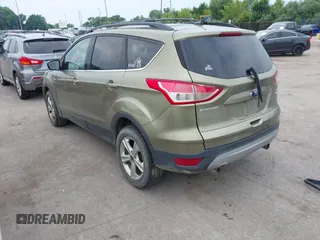 2013 Ford Escape SE with VIN 1FMCU9GX2DUC43098, listed as a IAAI auction lot 42687520 with 104,084 mi miles and . Bid and sale history available at DreamBid. Image 3.
