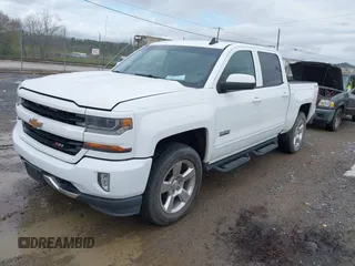 2016 Chevrolet Silverado 1500 LT with VIN 3GCUKREC0GG136136, listed as a IAAI auction lot 41971199 with 179,045 mi miles and . Bid and sale history available at DreamBid. Image 2.