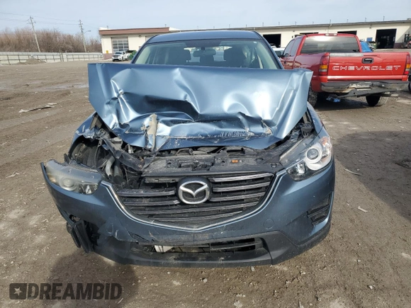 2016 Mazda CX-5 Sport with VIN JM3KE2BY0G0703866, listed as a Copart auction lot 43708185 with 186,790 mi miles and Salvage Title. Bid and sale history available at carsss.com. Image 5.