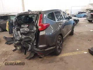 2018 Honda CR-V Touring with VIN 2HKRW2H91JH634457, listed as a IAAI auction lot 41697658 with 101,878 mi miles. Bid and sale history available at carsss.com. Image 4.