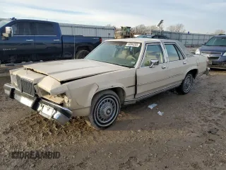 1987 Mercury Grand Marquis GS z VIN 2MEBM74F9HX714211, wystawiony jako Copart lot #43594205 z przebiegiem 26 933 mil mil oraz Szkody całkowita. Historia ofert i sprzedaży dostępna na DreamBid. Obrazek 1.