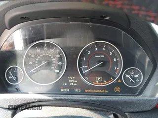 2013 BMW 3 Series 335i xDrive with VIN WBA3B9C54DF587421, listed as a IAAI auction lot 42165857 with 142,331 mi miles. Bid and sale history available at carsss.com. Image 7.