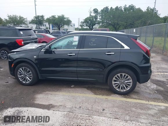 2024 Cadillac XT4 AWD Premium Luxury с VIN 1GYFZDR44RF147956, выставлен на аукционе IAAI как лот 42434595 с пробегом 26 328 миль миль и . История ставок и продаж доступна на DreamBid. Изображение 14.