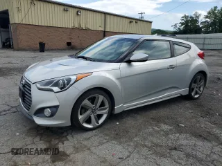 2013 Hyundai Veloster Turbo z VIN KMHTC6AE0DU127584, wystawiony jako Copart lot #61375525 z przebiegiem 128 913 mil mil oraz Szkoda całkowita • Salvage title. Historia ofert i sprzedaży dostępna na DreamBid. Obrazek 1.
