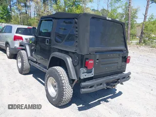 2002 Jeep Wrangler Sport with VIN 1J4FA49S52P700846, listed as a IAAI auction lot 42052276 with 231,851 mi miles. Bid and sale history available at carsss.com. Image 3.