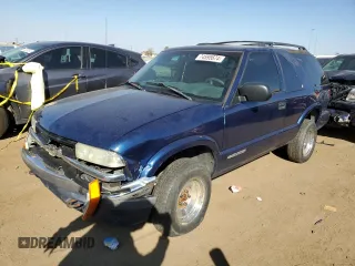 2001 Chevrolet Blazer LS z VIN 1GNCT18W91K189599, wystawiony jako Copart lot #74595674 z przebiegiem 208 309 mil mil oraz Szkoda całkowita • Salvage title. Historia ofert i sprzedaży dostępna na DreamBid. Obrazek 1.