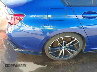 2020 BMW 3 Series M340i xDrive with VIN WBA5U9C06LFH24903, listed as a IAAI auction lot 41041530 with 55,949 mi miles and . Bid and sale history available at DreamBid. Image 13.