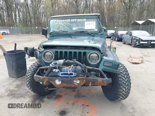 1999 Jeep Wrangler Sahara with VIN 1J4FY49S7XP440582, listed as a IAAI auction lot 41967151 with 163,710 mi miles and . Bid and sale history available at carsss.com. Image 12.
