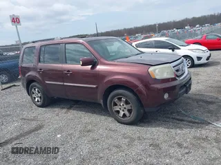 2010 Honda Pilot Touring with VIN 5FNYF4H95AB040721, listed as a IAAI auction lot 41928412 with 213,219 mi miles and . Bid and sale history available at carsss.com. Image 13.