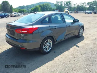 2015 Ford Focus SE with VIN 1FADP3F25FL300945, listed as a IAAI auction lot 42483699 with 76,992 mi miles and . Bid and sale history available at DreamBid. Image 4.