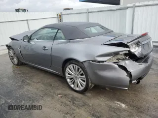 2010 Jaguar XK with VIN SAJWA4GB4ALB37114, listed as a Copart auction lot 77673824 with 99,999 mi miles and Salvage Title. Bid and sale history available at carsss.com. Image 2.