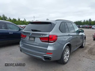 2014 BMW X5 xDrive50i with VIN 5UXKR6C54E0C02423, listed as a IAAI auction lot 42278044 with 122,370 mi miles and . Bid and sale history available at DreamBid. Image 4.