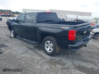 2017 Chevrolet Silverado 1500 LT with VIN 3GCUKREC9HG374973, listed as a IAAI auction lot 41423560 with 141,661 mi miles. Bid and sale history available at carsss.com. Image 3.