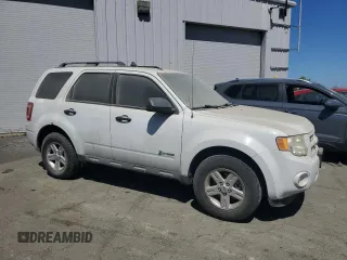 2011 Ford Escape Hybrid z VIN 1FMCU5K39BKA88197, wystawiony jako Copart lot #50896195 z przebiegiem 186 007 mil mil oraz Czysty tytuł • Clean title. Historia ofert i sprzedaży dostępna na DreamBid. Obrazek 4.