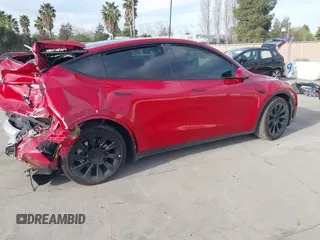 2023 Tesla Model Y Long Range with VIN 7SAYGAEE7PF713761, listed as a IAAI auction lot 41638067 with 46,089 mi miles and . Bid and sale history available at DreamBid. Image 4.