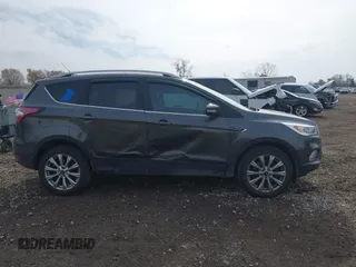 2017 Ford Escape Titanium with VIN 1FMCU9J98HUA49434, listed as a IAAI auction lot 40710866 with 143,850 mi miles. Bid and sale history available at carsss.com. Image 13.