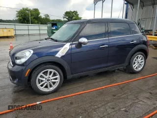 2015 MINI Countryman with VIN WMWZB3C54FWR46454, listed as a Copart auction lot 63014745 with 124,820 mi miles and Salvage title. Bid and sale history available at DreamBid. Image 1.