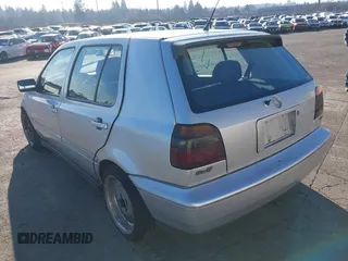 1999 Volkswagen Golf z VIN 3VWJA81HXXM215507, wystawiony jako IAAI lot #41391464 z przebiegiem 167 875 mil mil oraz . Historia ofert i sprzedaży dostępna na DreamBid. Obrazek 3.