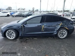 2021 Tesla Model 3 Long Range with VIN 5YJ3E1EB8MF936695, listed as a IAAI auction lot 41778553 with 50,732 mi miles. Bid and sale history available at carsss.com. Image 13.