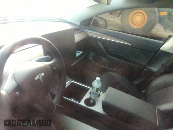 2023 Tesla Model 3 z VIN 5YJ3E1EA3PF449187, wystawiony jako IAAI lot #40320939 z przebiegiem Nie podano mil oraz . Historia ofert i sprzedaży dostępna na DreamBid. Obrazek 16.