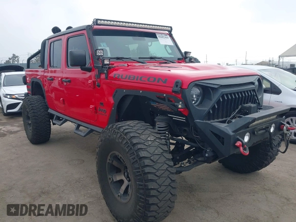 2020 Jeep Gladiator Rubicon with VIN 1C6JJTBG4LL178260, listed as a IAAI auction lot 42602460 with 61,899 mi miles and . Bid and sale history available at DreamBid. Image 1.