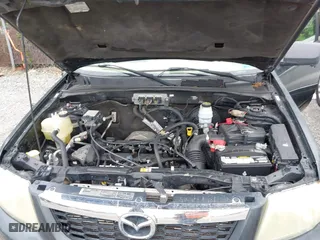 2008 Mazda Tribute Touring with VIN 4F2CZ02ZX8KM25983, listed as a IAAI auction lot 42122836 with 148,080 mi miles. Bid and sale history available at carsss.com. Image 10.