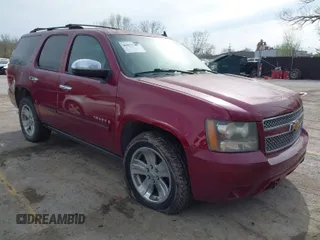 2007 Chevrolet Tahoe LTZ z VIN 1GNFK130X7R319974, wystawiony jako IAAI lot #41955206 z przebiegiem 187 445 mil mil oraz . Historia ofert i sprzedaży dostępna na DreamBid. Obrazek 1.