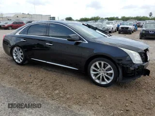 2015 Cadillac XTS Luxury with VIN 2G61M5S35F9225559, listed as a Copart auction lot 55638885 with 130,620 mi miles and Clean title. Bid and sale history available at DreamBid. Image 4.