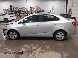 2014 Chevrolet Sonic LT with VIN 1G1JC5SG8E4107664, listed as a IAAI auction lot 41614306 with 128,946 mi miles and . Bid and sale history available at DreamBid. Image 14.